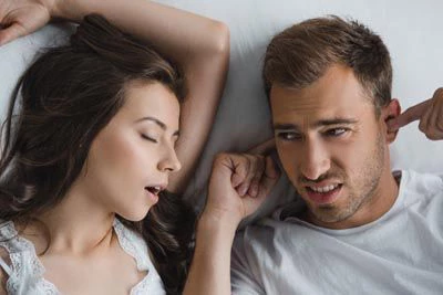 man awake at night due to his wife's sleep apnea