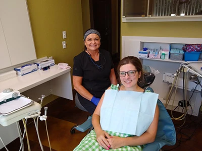 A dental patient at Mira Vista Dental in the chair smiling